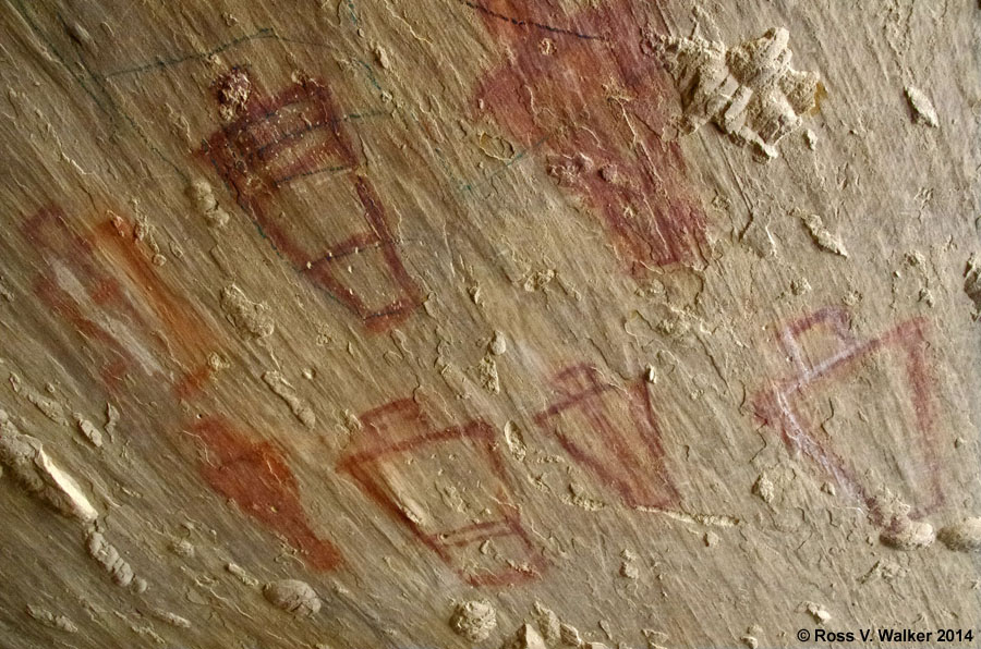 Anthropomorph pictographs under a leaning rock slab in 9 Mile Canyon, Utah