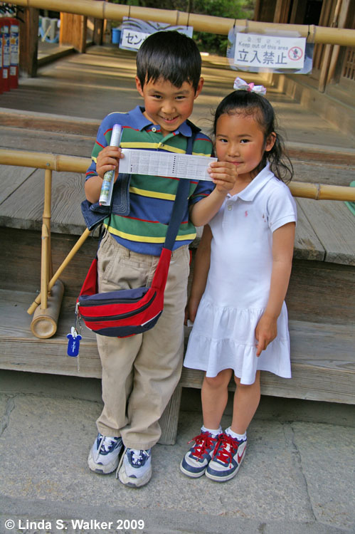 Kids show their fortune, Golden Pavilion, Kyoto, Japan
