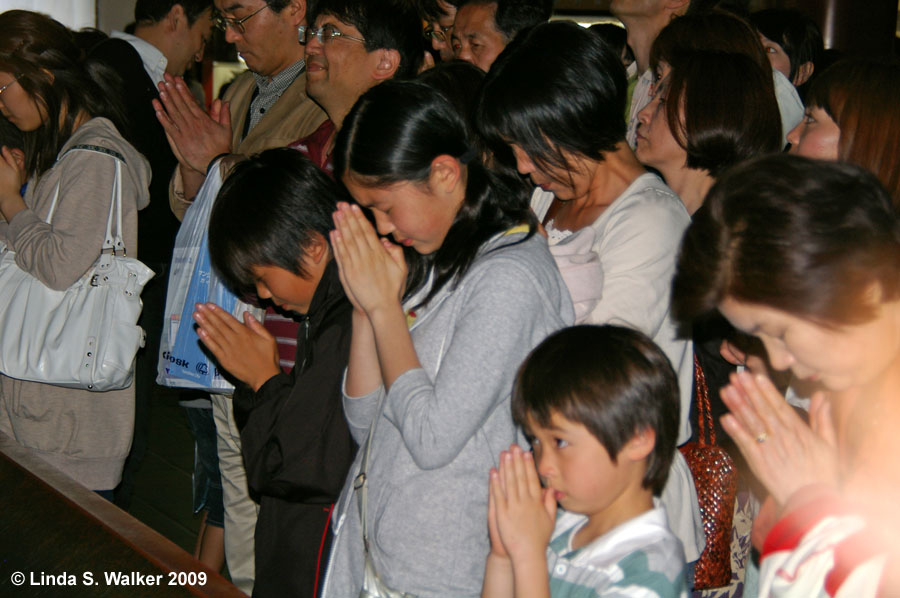 Prayers at Asakusa Temple, Tokyo, Japan