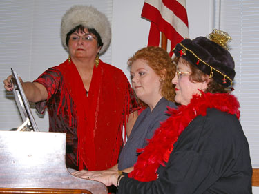 Becky Williams and Linda Walker play "Sleigh Ride" with Gloria Cheirrett