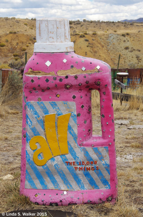 A mysterious giant detergent bottle stands in a back yard in Tuscarora, Nevada