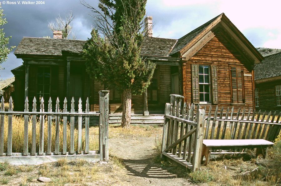 An open gate invites you to explore this old house, Bannack, Montana