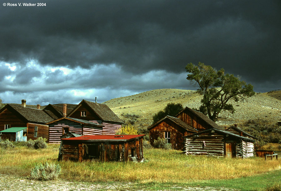 Houses under storm clouds, Bannack, Montana