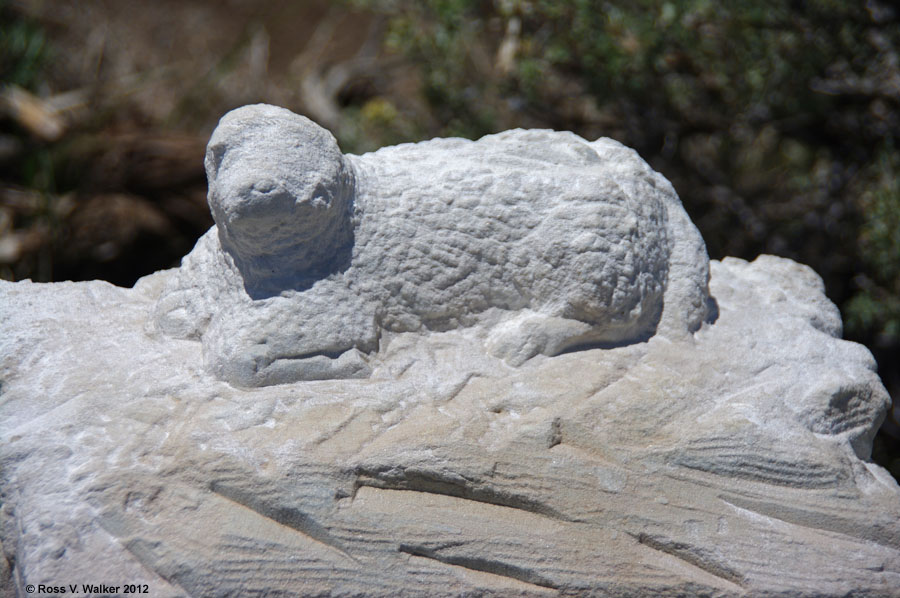 Defaced lamb on George W. Conway's grave in the cemetery at Bodie, California