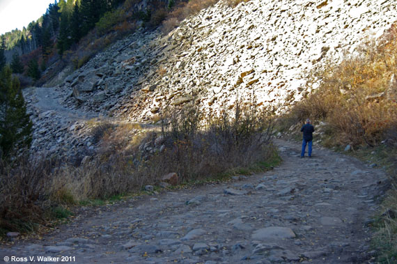 Walking toward a bench through a rockslide area on the Crystal / Marble road.