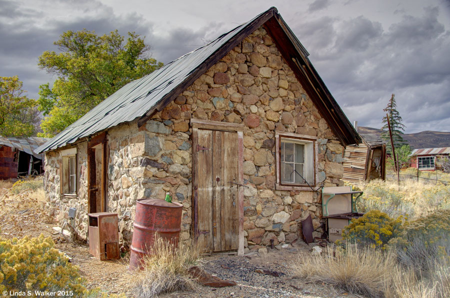 A stone house with an ancient stove, in Tuscarora, Nevada