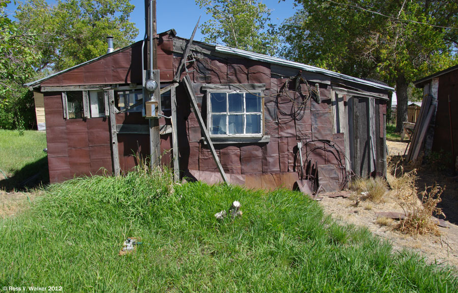 An old house with rusty tin can siding, Tuscarora, Nevada