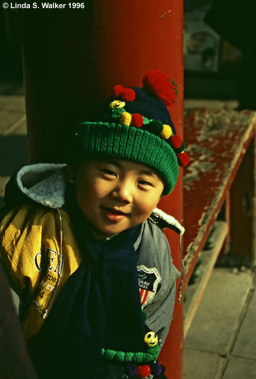 Child in an American jacket, Temple Of Heaven, Beijing, China
