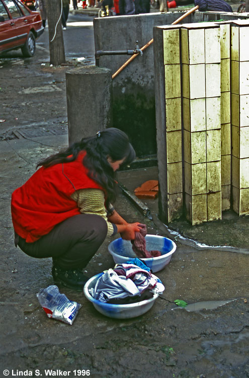 Woman Doing Laundry at a Public Faucet, X'ian, China