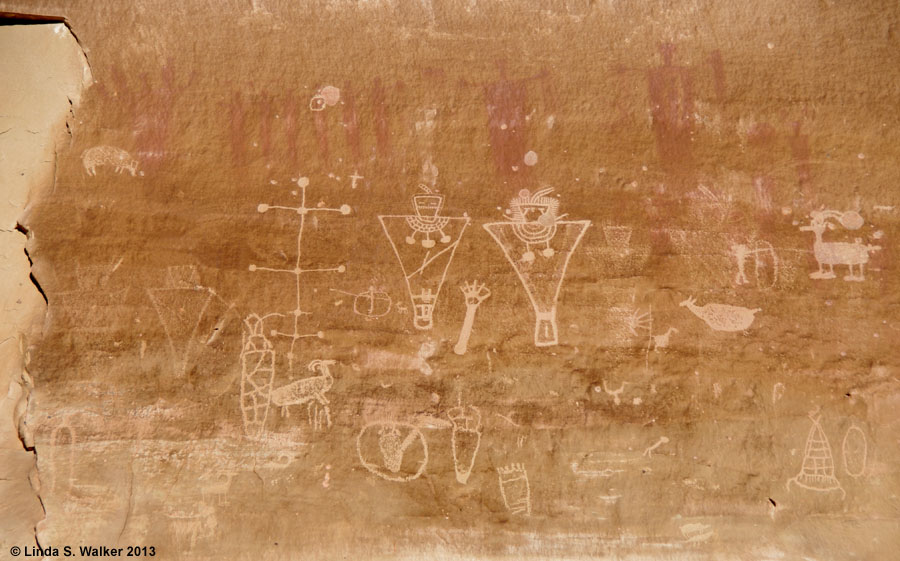 Fremont petroglyph panel,  traces of Barrier Canyon pictographs, Sego Canyon, UT