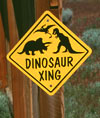 Dinosaur crossing sign