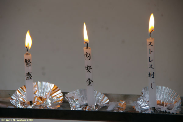Candles at the Golden Pavilion shrine, Kyoto, Japan