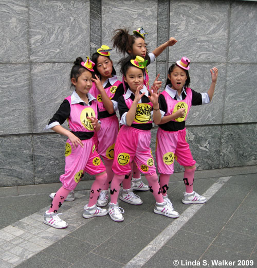 Kids dancing near Hamarikyu Garden, Tokyo, Japan