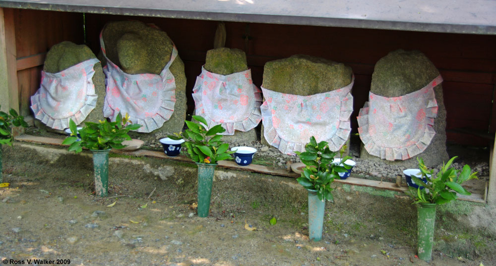 Aprons on Jizo stones, Ryoanji Temple, Kyoto, Japan