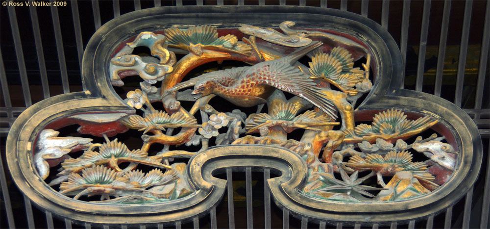 Wood carving over an entrance to Nijo Castle, Kyoto, Japan