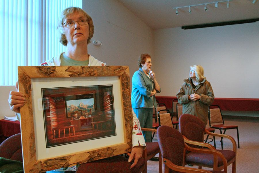 Hanging photo contest prints, Montpelier, Idaho