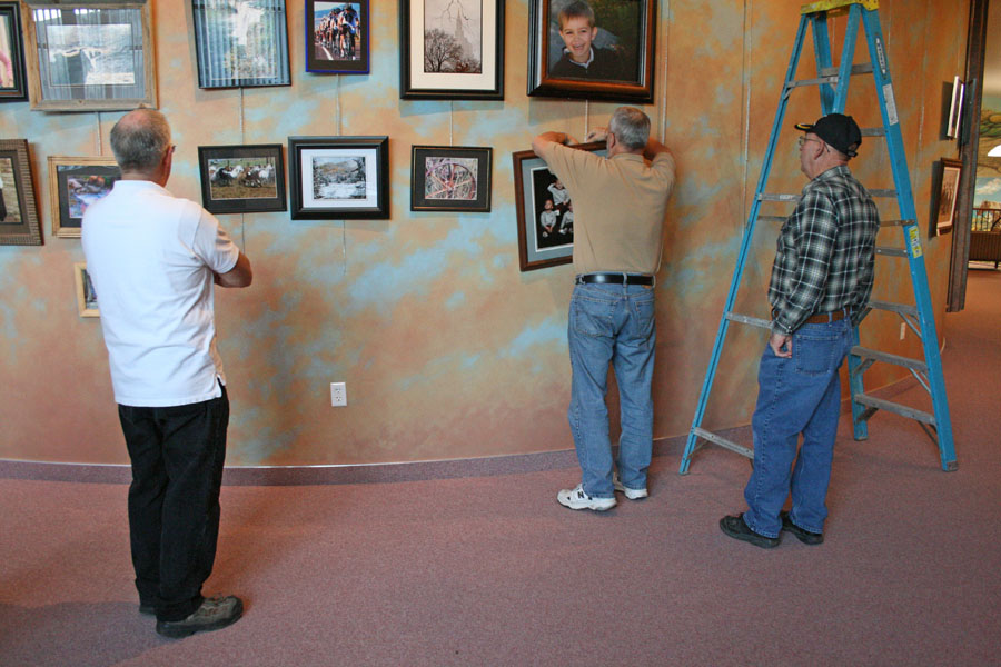 Hanging photo contest prints, Montpelier, Idaho