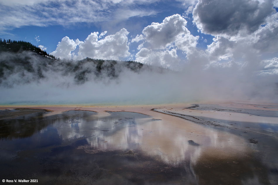 Reflection and steam on the edge of Grand Prismatic Spring, Yellowstone National Park, Wyoming