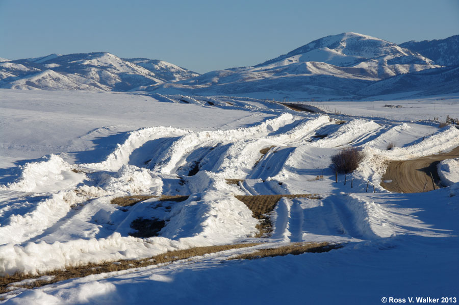 Dikes are plowed to catch drifting snow along Pescadero Road near Bern, Idaho.
