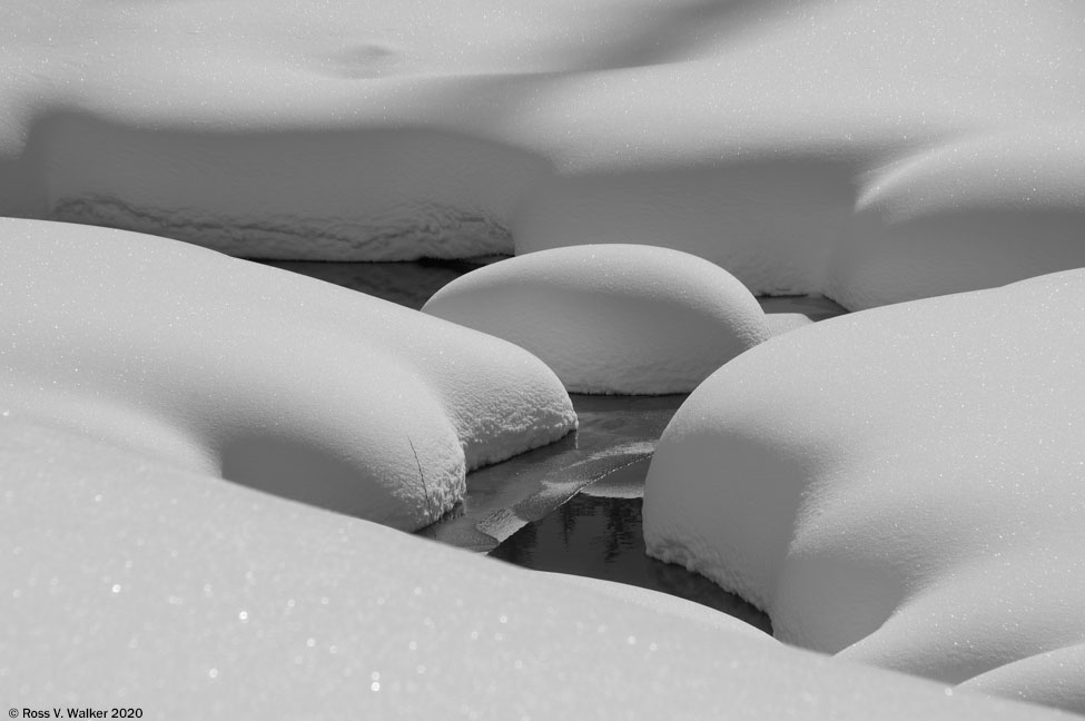 Snow shapes and shadows along Salt Creek, Wyoming