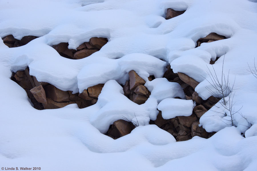 Snow clinging to rocks in Dry Fork Canyon, Wyoming