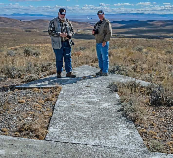 Photographers on the giant concrete arrow at Golconda Summit, Nevada
