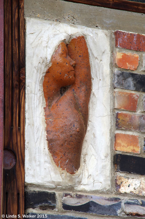 A beautiful bust has become part of the structure of a building in Tuscarora, Nevada