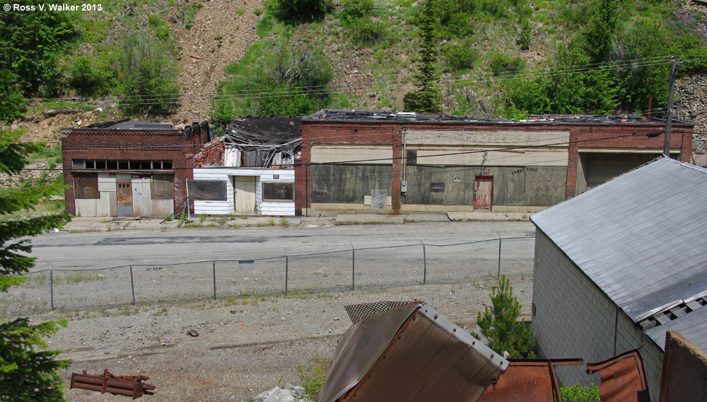 Abandoned stores across the street from the Hecla buildings, Burke, Idaho