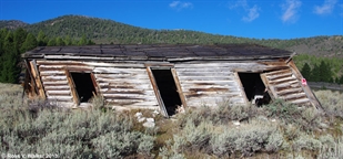 Leaning log cabin, Gilmore, Idaho