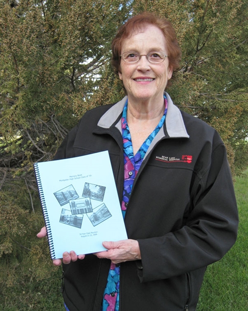 Linda Walker with high school memory book